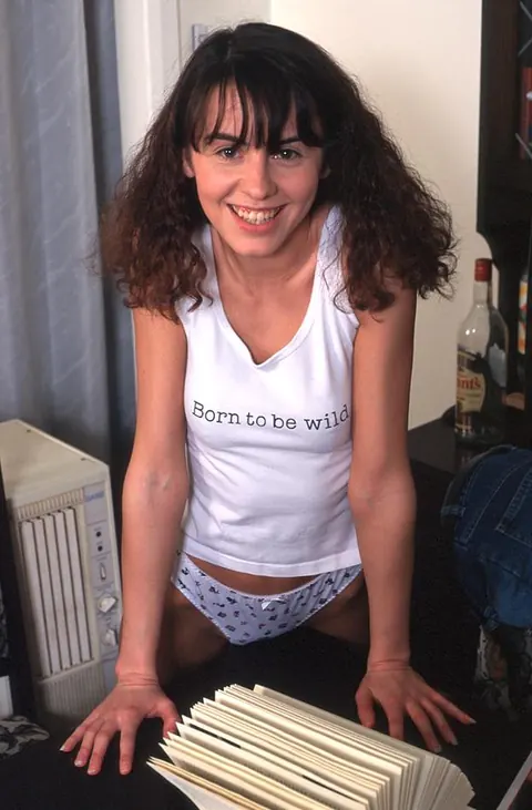 Slim Curly Woman Strips Out of Her Office Uniform – photo 4 of 19