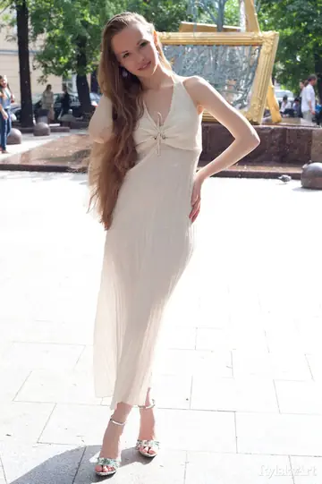 Slim Brunette Strips Out of Her Dress in the Open Air