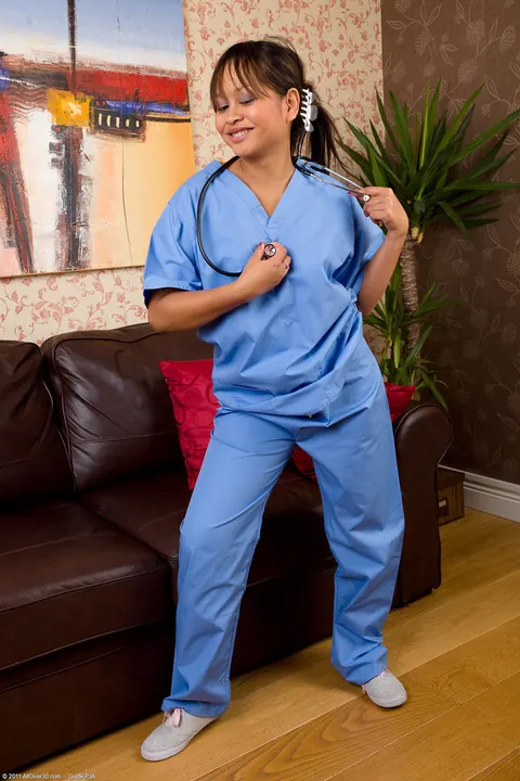 Asian MILF Nurse with Big Tits Poses Nude – photo 2 of 21