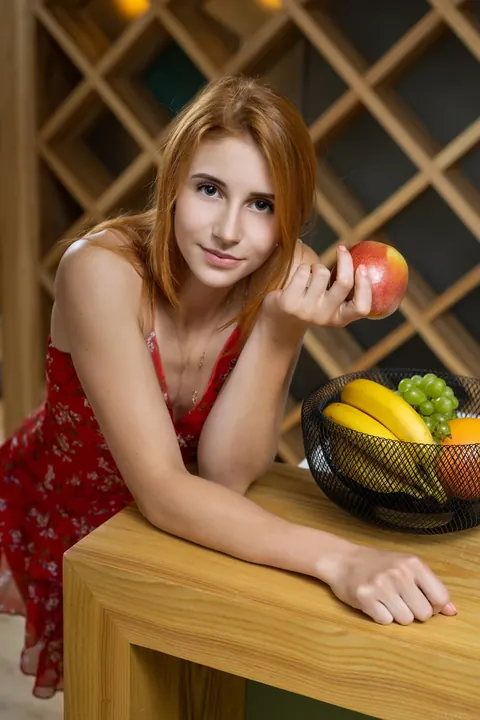 Petite Redhead Peels Off Her Dress on a Kitchen Table – photo 1 of 21