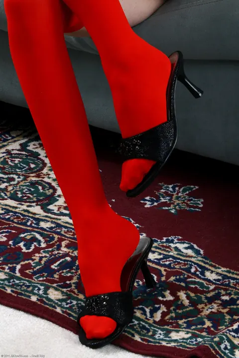 Curly Blonde MILF in Stockings Sucks Her Toes on the Sofa – photo 3 of 21