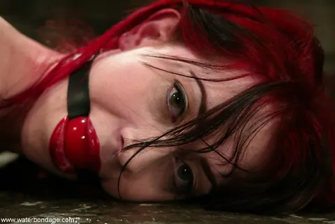 Mina Meow: Tattooed Redhead in a Latex Dress Endures Water Bondage in Heels – photo 13 of 21