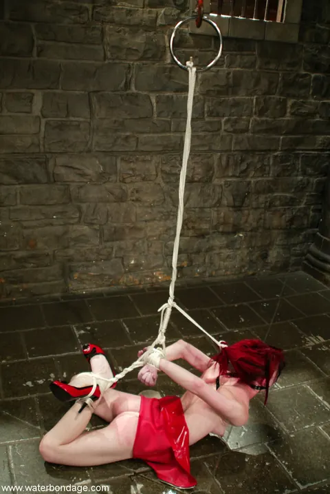 Mina Meow: Tattooed Redhead in a Latex Dress Endures Water Bondage in Heels – photo 21 of 21
