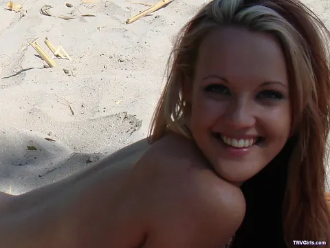 Petite Tanned Babe Poses Nude and Spreads on the Beach – photo 7 of 21