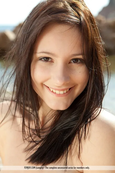 European Brunette Poses Naked on a Rocky Beach – photo 16 of 16