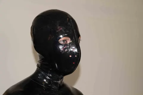 JANA PUFF: European Brunette in Latex Spanks a Male Sub with Her Lover – photo 13 of 17