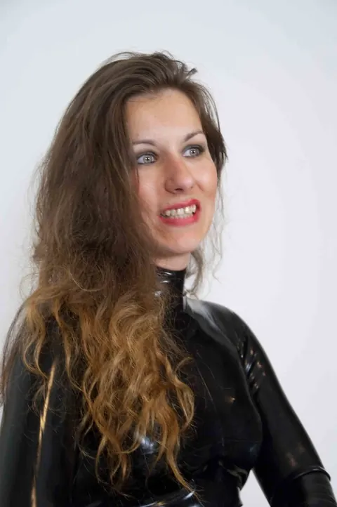 JANA PUFF: European Brunette in Latex Spanks a Male Sub with Her Lover – photo 7 of 17