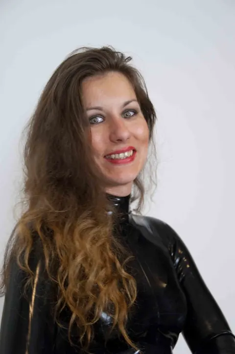 JANA PUFF: European Brunette in Latex Spanks a Male Sub with Her Lover – photo 6 of 17