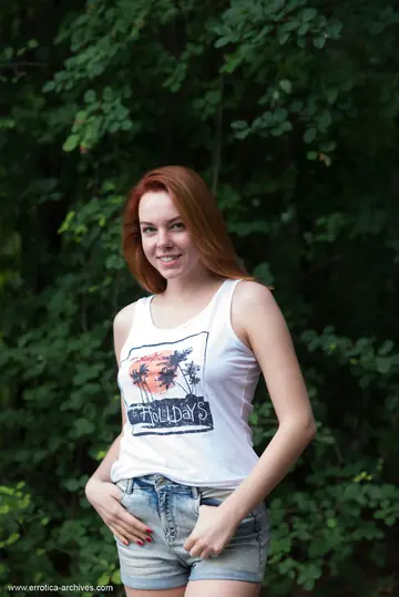 Redhead with Natural Tits Spreads Outdoors by Water