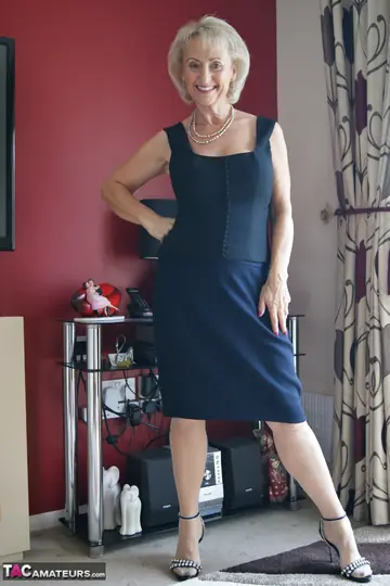Mature British Blonde Strips Off Her Dress and Fingers in Stockings