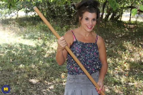 Nicole Newby: Mature Brunette MILF Flashes Her Shaved Pussy and Masturbates Outdoors – photo 1 of 16