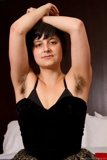 Busty Black-Haired Woman Pulls Panties Aside to Show Hairy Armpits and Pussy