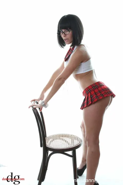 Danni Gee: Petite Brunette MILF Poses in Uniform, Glasses and Heels – photo 6 of 15