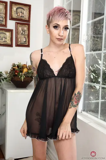 Blonde with Natural Tits and Tattoo Strips and Bares Her Body