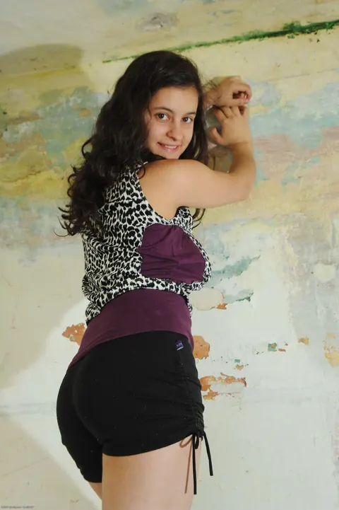Curly Brunette with Big Tits Strips Out of Her Shorts – photo 3 of 21