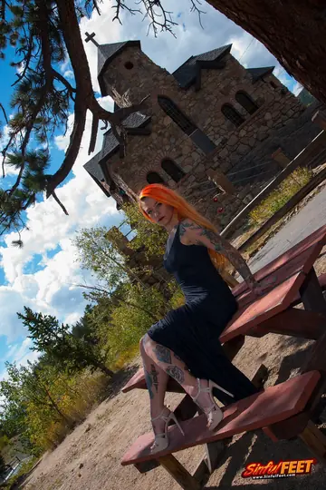 Redhead in a Skirt and Heels Exposes Her Feet Outdoors