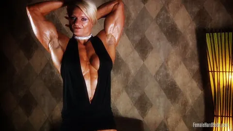 Brigita Brezovac: Blonde MILF Flexes Her Muscles in a Black Dress – photo 8 of 21