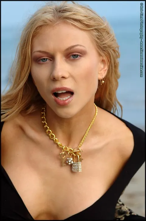 Blonde MILF with Piercing Poses in Panties on the Beach – photo 13 of 15