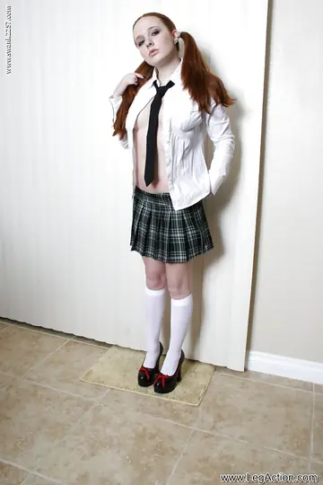 Redhead in Costume Spreads Her Pussy