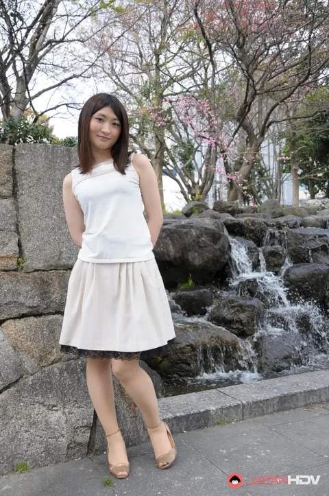 Japanese Brunette Poses Outdoors in a Skirt and High Heels – photo 1 of 15
