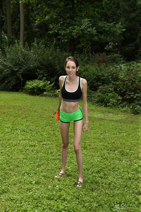 Aria Haze: Skinny Brunette in Shorts Masturbates with a Dildo Outdoors – photo 3 of 16