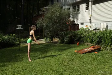 Skinny Brunette in Shorts Masturbates with a Dildo Outdoors