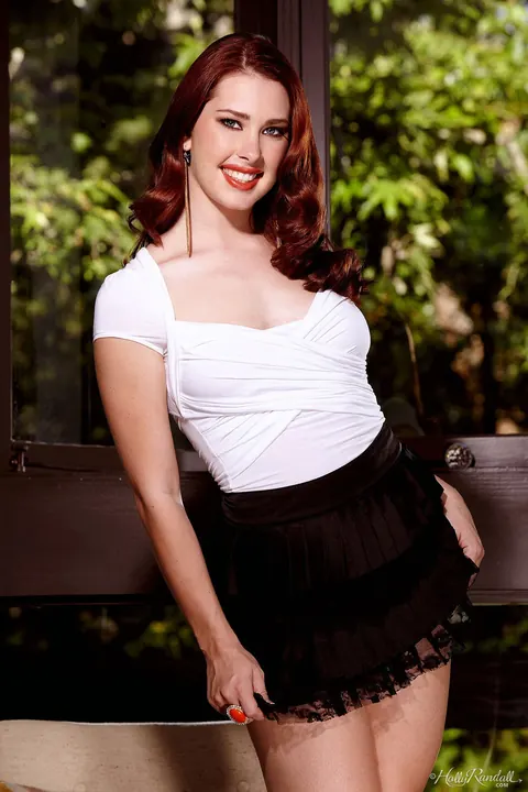 Melody Jordan: Tall Redhead Strips Out of Her Skirt and Uses a Dildo – photo 1 of 21