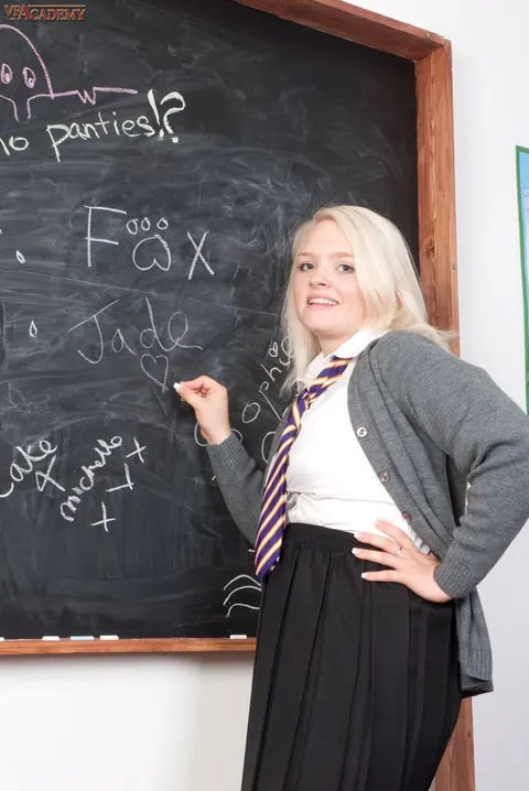 Jade Samantha: Curvy Blonde in Uniform and Stockings Frees Her Pussy – photo 2 of 16