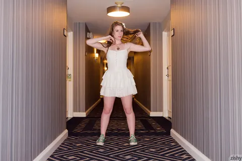 Redhead in Glasses Shows Her Panties in a Hotel Room – photo 9 of 11