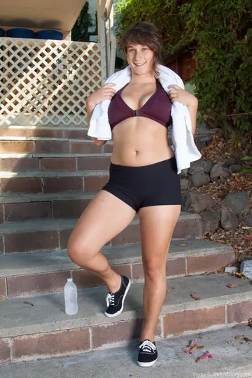Busty Hairy Woman Pulls Shorts Aside Outdoors