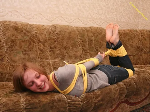 Short-Haired Woman Hogtied in Jeans on the Sofa – photo 10 of 16