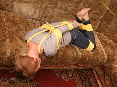 Short-Haired Woman Hogtied in Jeans on the Sofa – photo 13 of 16