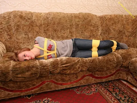Short-Haired Woman Hogtied in Jeans on the Sofa – photo 5 of 16