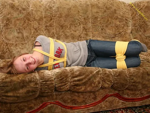Short-Haired Woman Hogtied in Jeans on the Sofa – photo 6 of 16