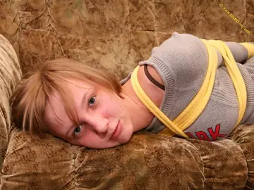 Short-Haired Woman Hogtied in Jeans on the Sofa