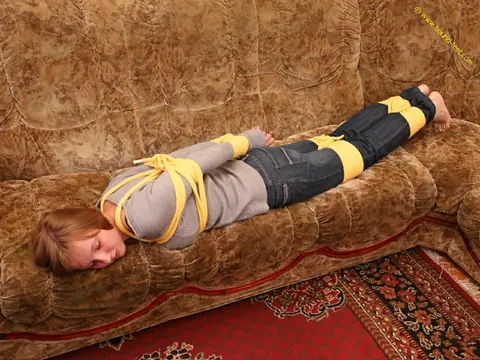 Short-Haired Woman Hogtied in Jeans on the Sofa – photo 2 of 16