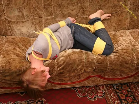 Short-Haired Woman Hogtied in Jeans on the Sofa – photo 14 of 16