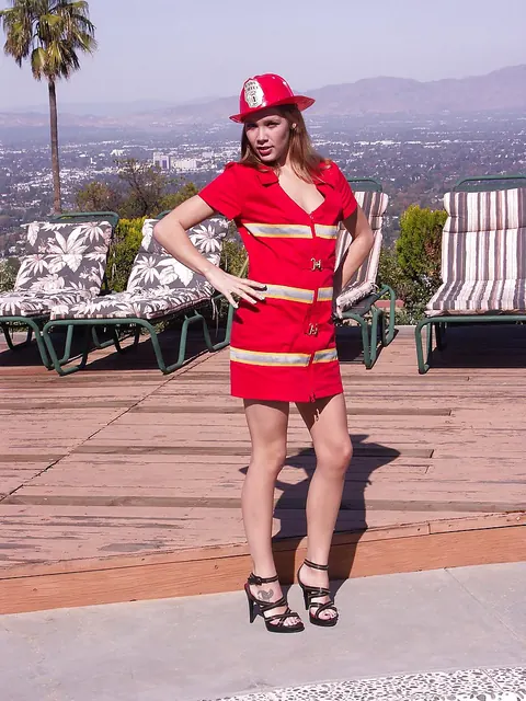 Rebecca Riley: Thick Redhead MILF Lifts Her Uniform Skirt Outdoors – photo 1 of 16