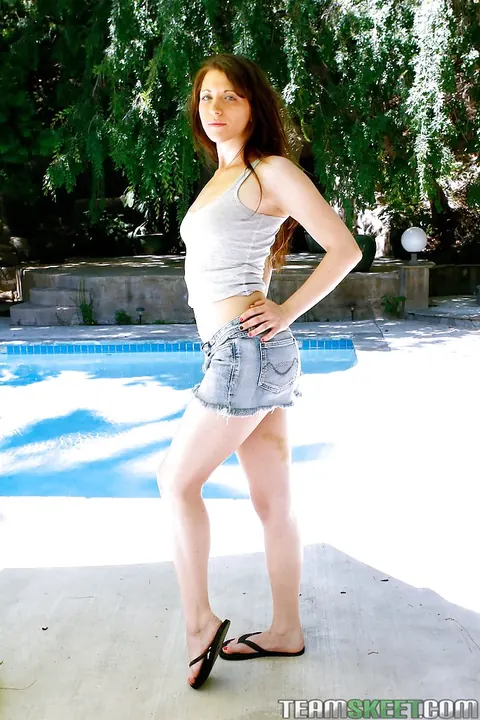 Kristine Kay: Brunette Strips Out of Her Shorts by the Pool – photo 5 of 16