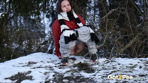European Brunette Squats and Pisses on Snowy Ground – photo 5 of 15