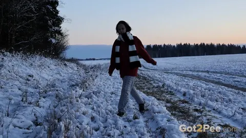European Brunette Squats and Pisses on Snowy Ground – photo 1 of 15