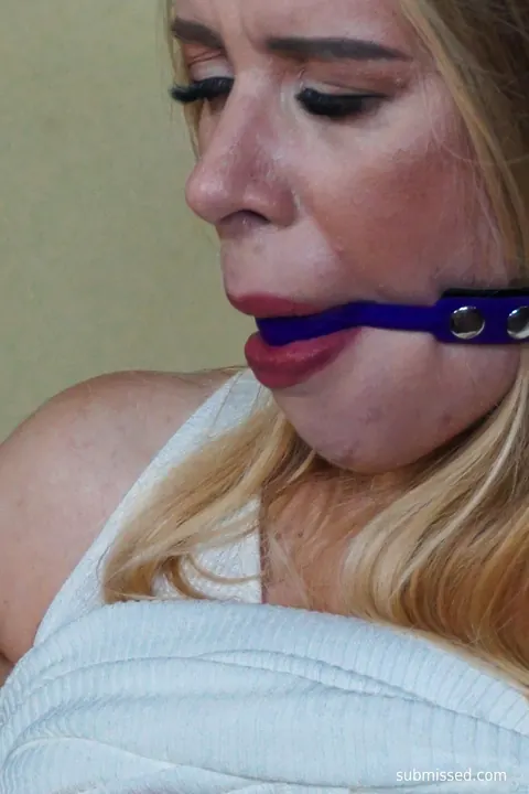 Blonde Woman Restrained in Cuffs and Ropes – photo 13 of 21