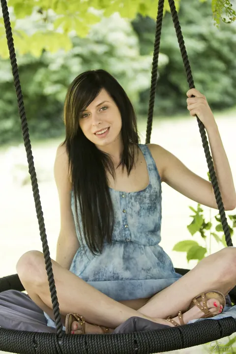 Daniela Rose: Slim Brunette Spreads Her Shaved Pussy Outdoors on a Swing – photo 6 of 17