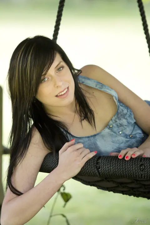 Daniela Rose: Slim Brunette Spreads Her Shaved Pussy Outdoors on a Swing – photo 2 of 17