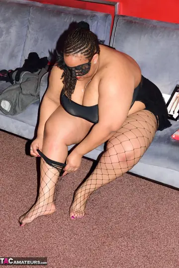 Busty Ebony Latina Strips Out of Her Stockings