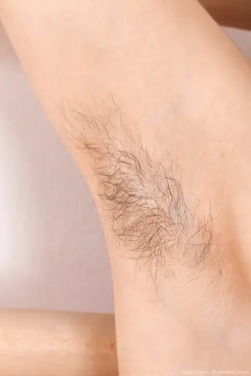 Slim Tall Brunette Displays Hairy Armpits and Pussy