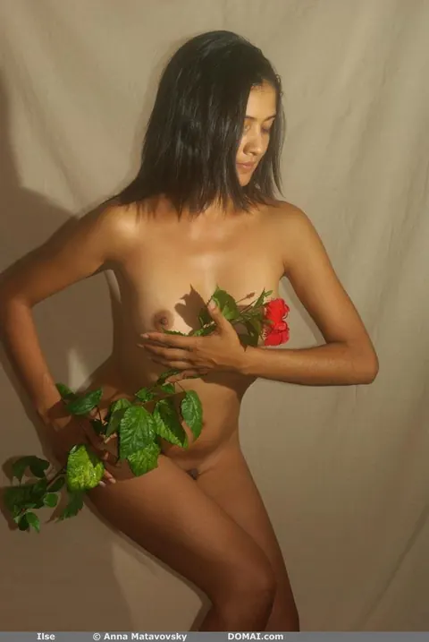 Woman Strips Nude and Poses Front and Back Arching Her Spine – photo 8 of 21