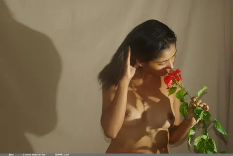 Woman Strips Nude and Poses Front and Back Arching Her Spine – photo 7 of 21