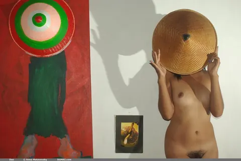 Woman Strips Nude and Poses Front and Back Arching Her Spine – photo 5 of 21