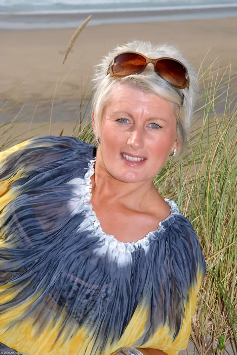 Short-Haired Mature Blonde Spreads Her Pierced Pussy on the Beach – photo 2 of 20